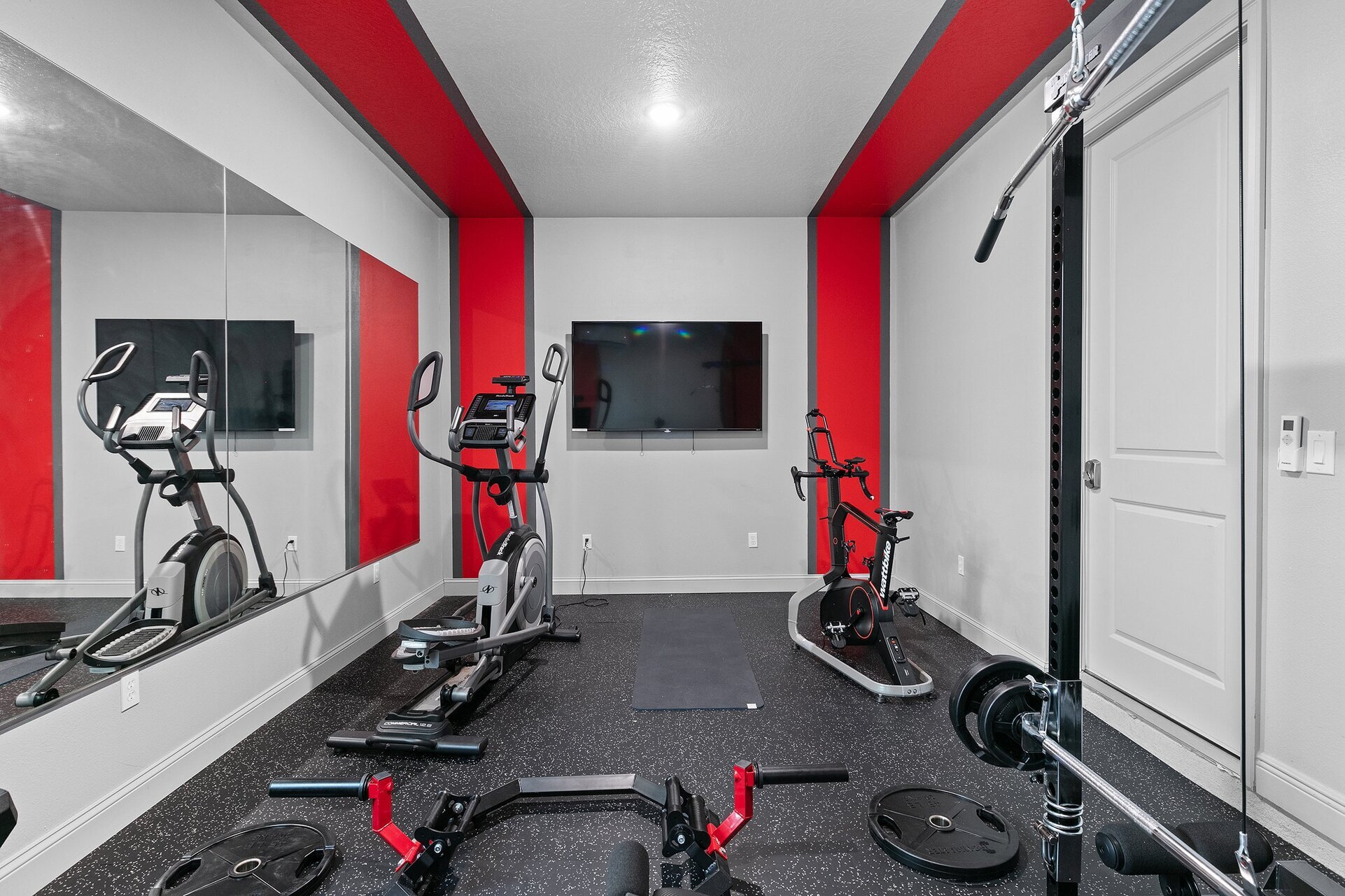 With an Ironmaster 2000, Wattbike, NordicTrack elliptical, free weights, and a Smart TV, you will have all that you need for a great workout