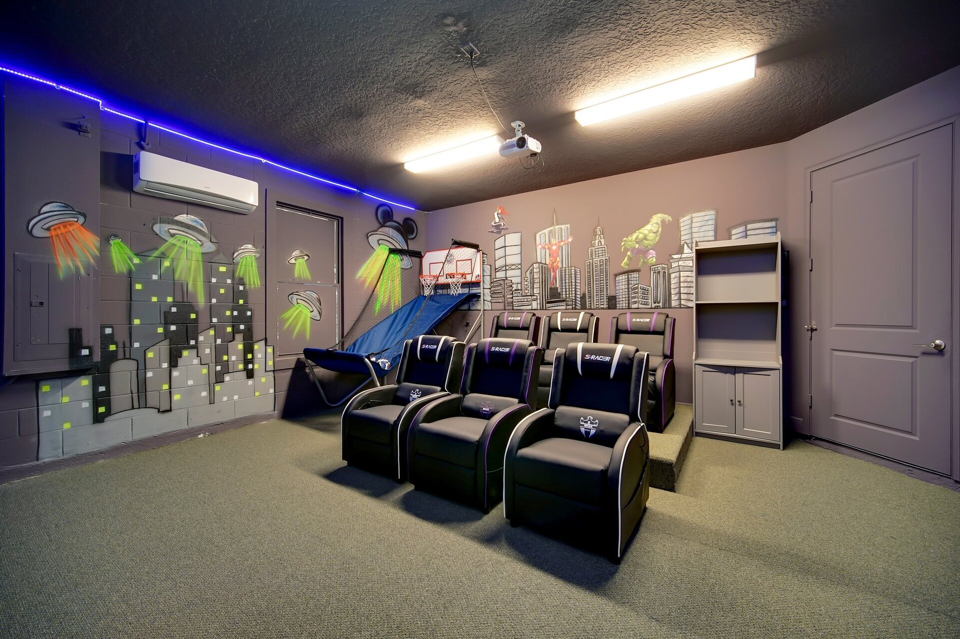 This glow in the dark theater and game room has seating for 8 guests and basketball and see-ball.