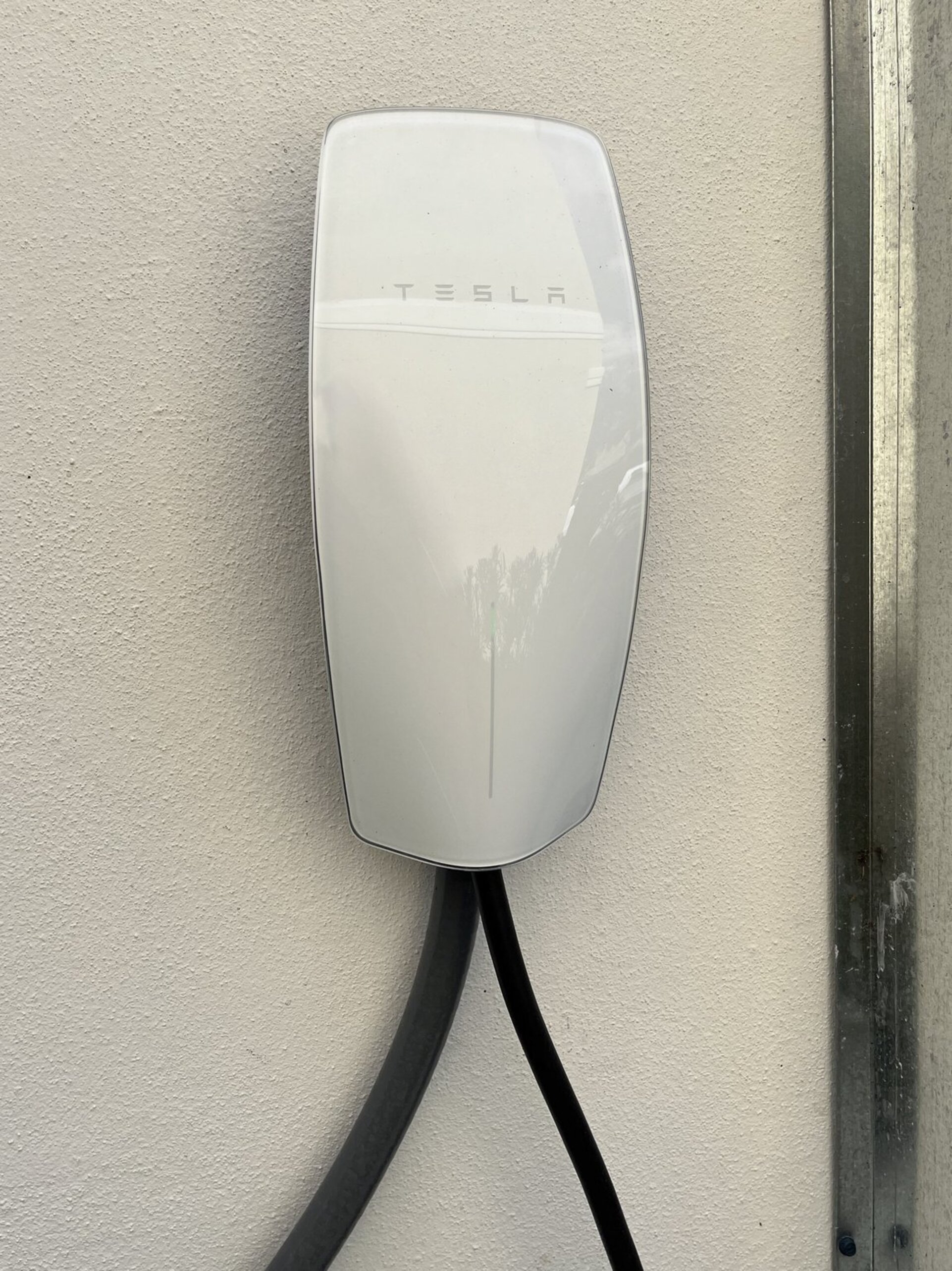 The house comes fully equipped with a Tesla charger!