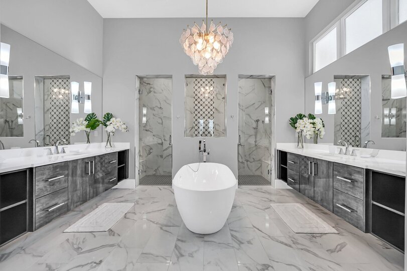 Step into luxury and say 'wow' as you enter this spacious bathroom! Featuring a stunning bathtub in the center and a walk-in shower.