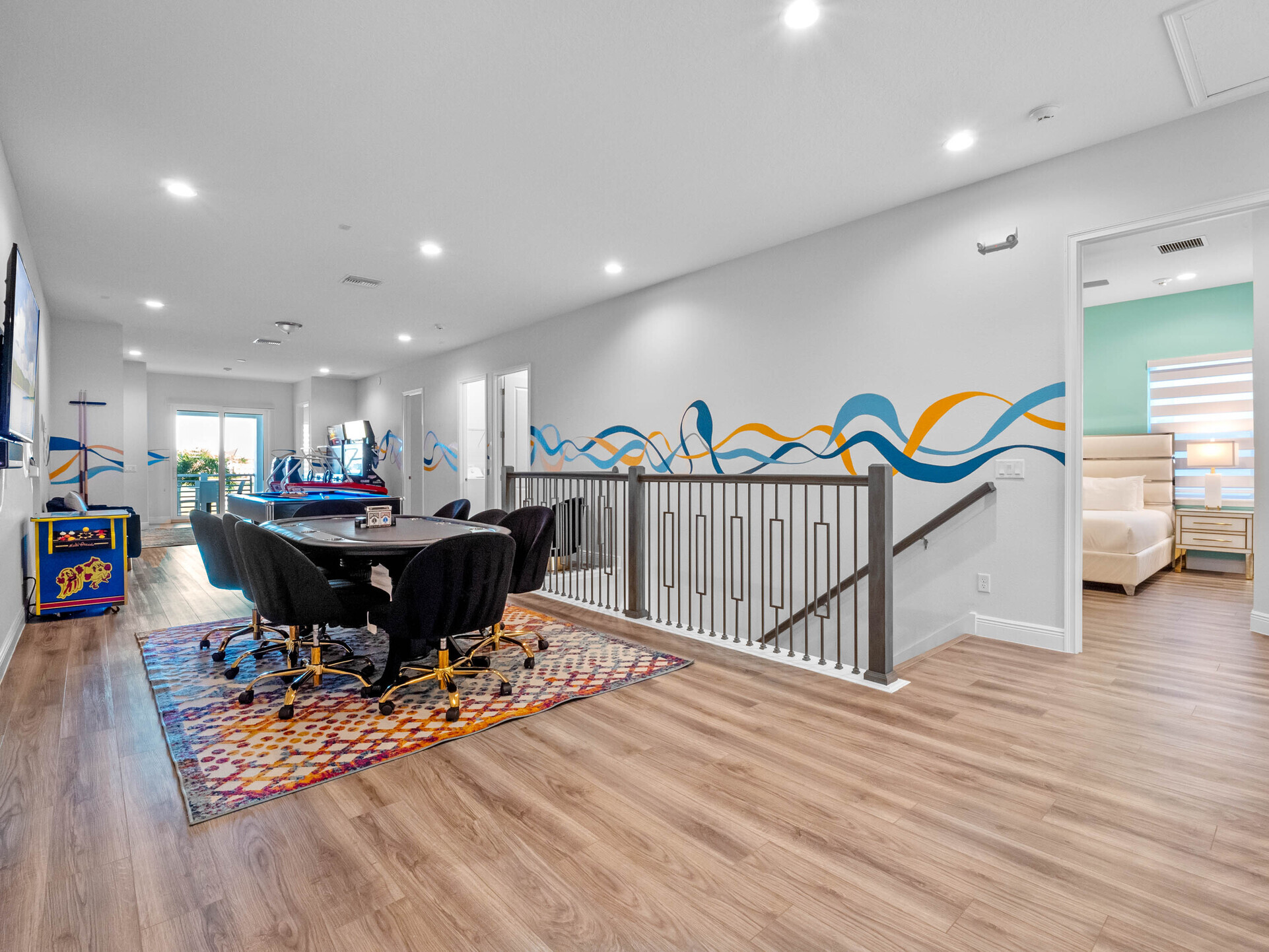 Step into the ultimate entertainment zone! This lounge area is a haven for fun-seekers, featuring a pool and poker table alongside a thrilling NASCAR car racing arcade. Let the games begin!