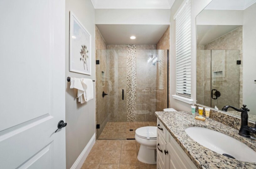 The en-suite bathroom has a walk-in shower