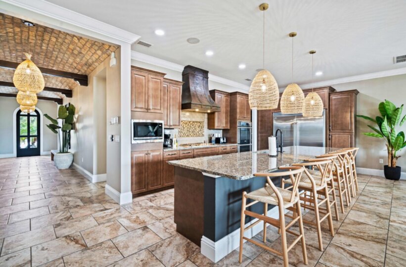 A fully equipped kitchen with breakfast bar