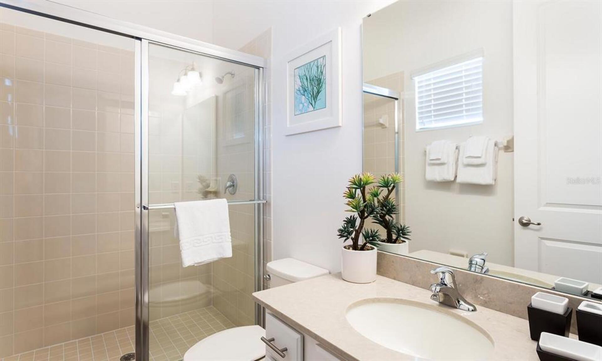 Enjoy the convenience of an en-suite bathroom featuring a walk-in shower for a refreshing start to your day
