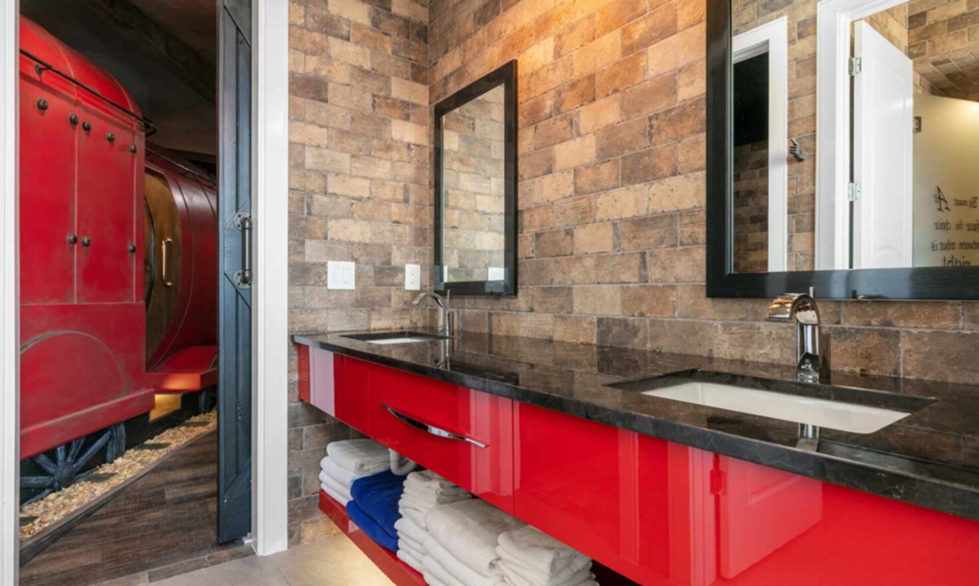 Train Station Bathroom with Double Vanities and Two Showers