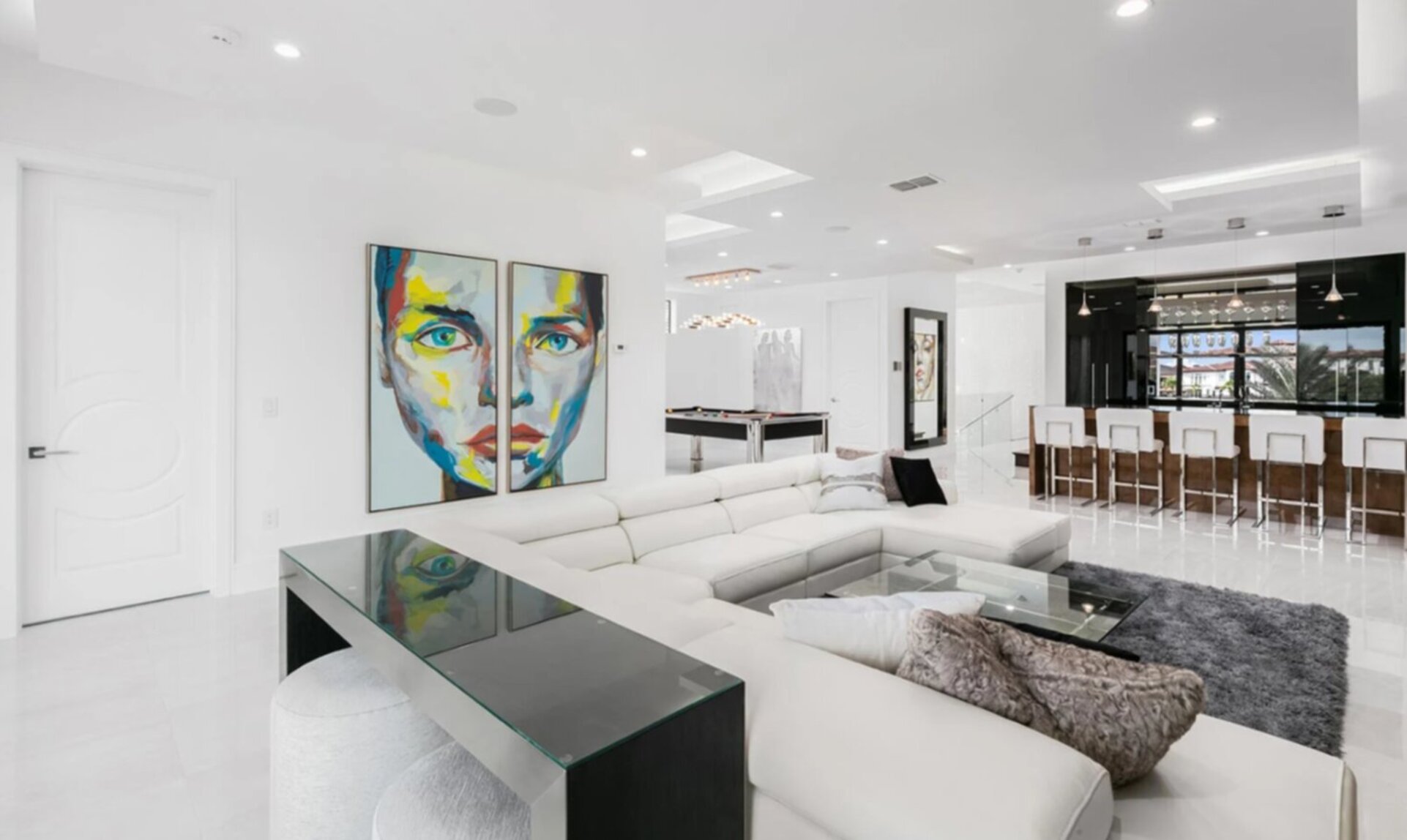 Second Floor Gathering Room with Modern Leather Sectional, Wet Bar, and Billiards