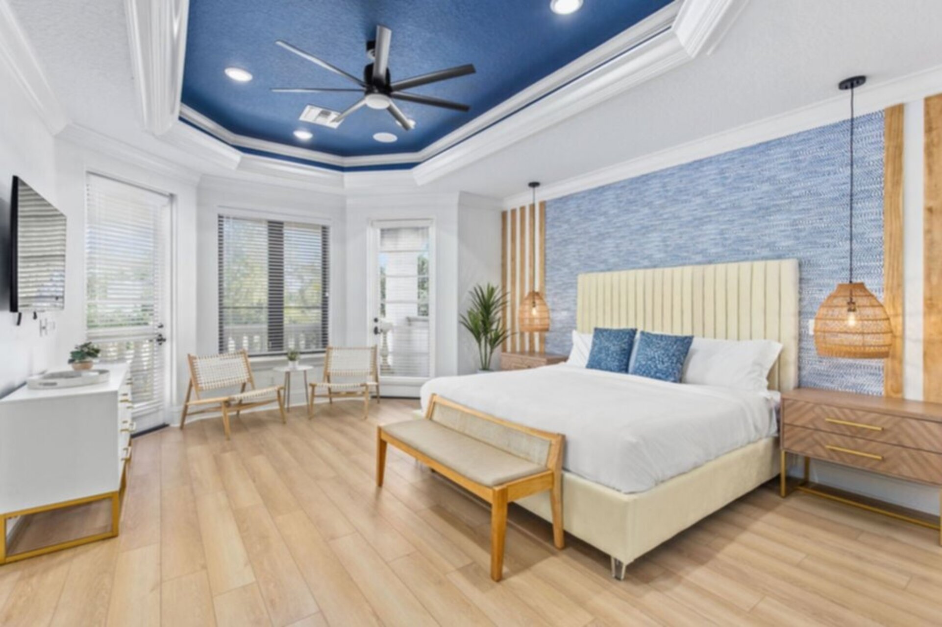 Escape to the vibrant master bedroom, a spacious retreat adorned with colorful decor and comfortable furnishings