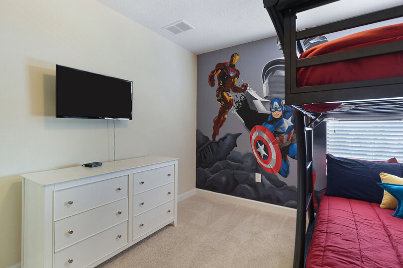 Featuring a full over full bunk bed and SMART TV