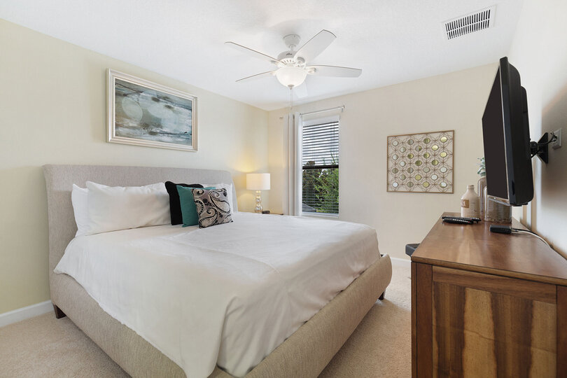 Another master suite with a king-sized bed and ensuite bathroom