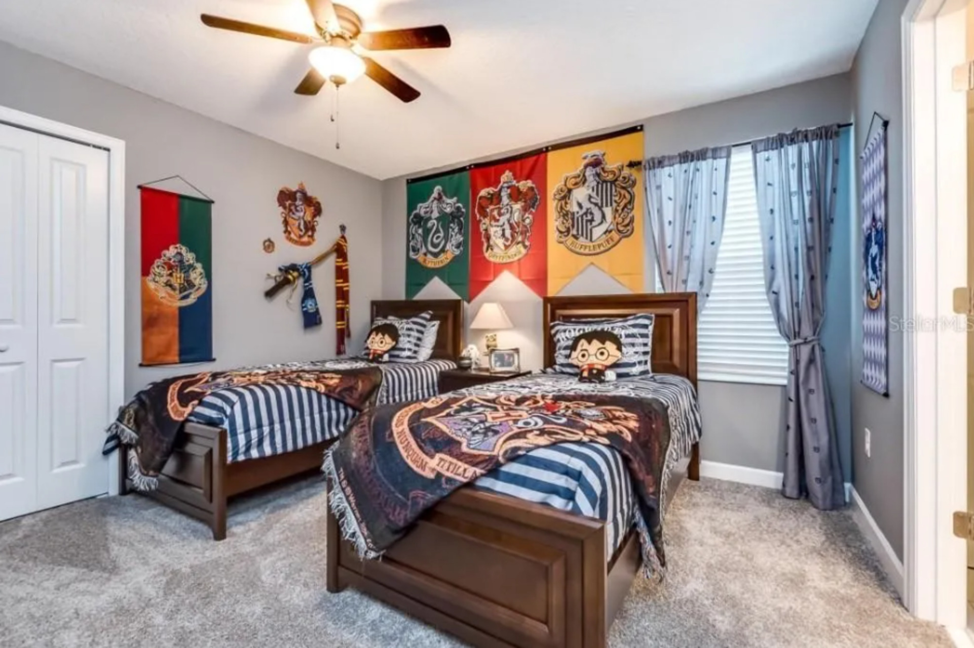Escape to this vibrant kids bedroom, a spacious retreat adorned with colorful decor and comfortable furnishings