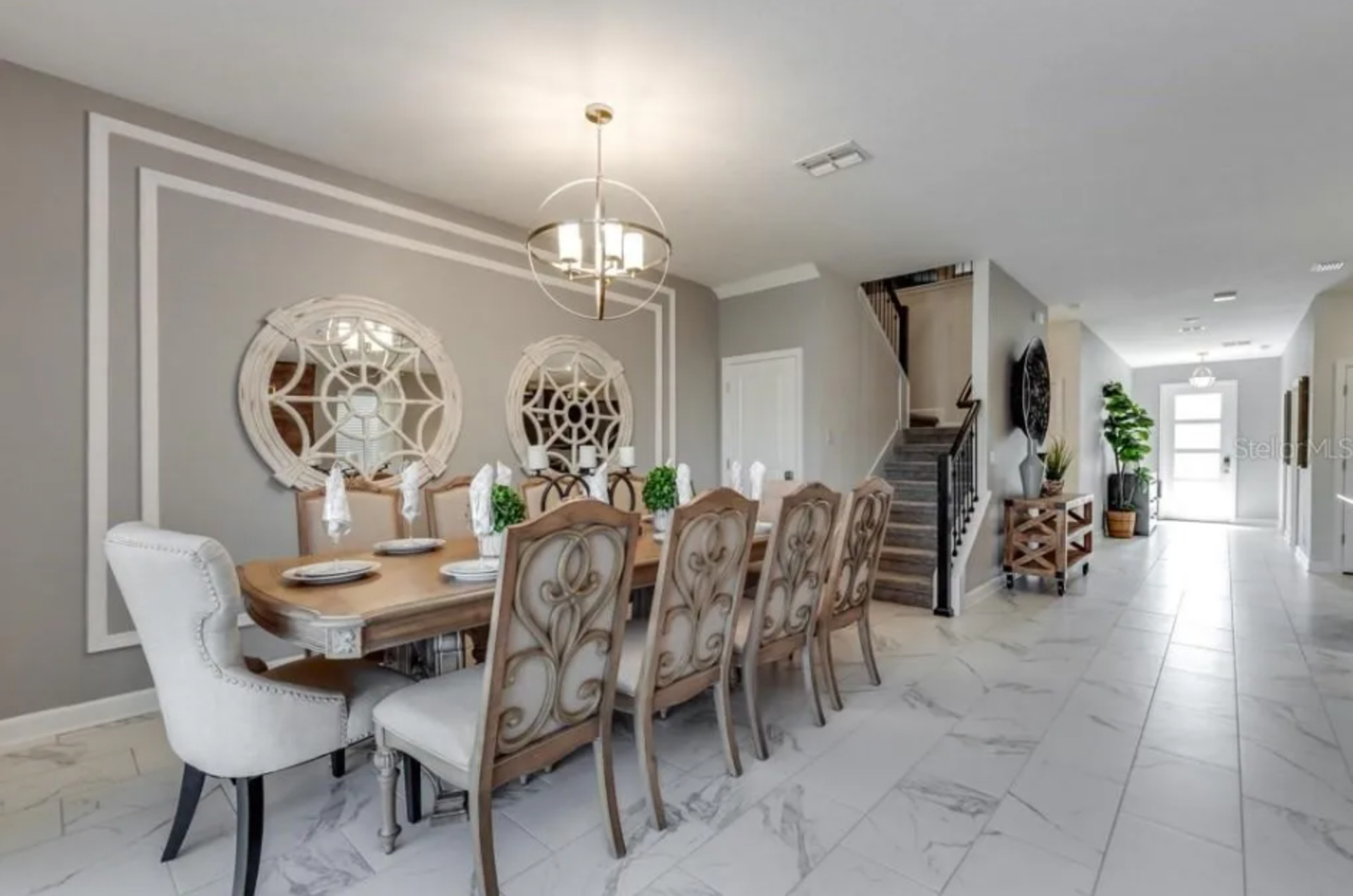 Dine in style at the formal dining table, which comfortably seats 10 guests for any occasion