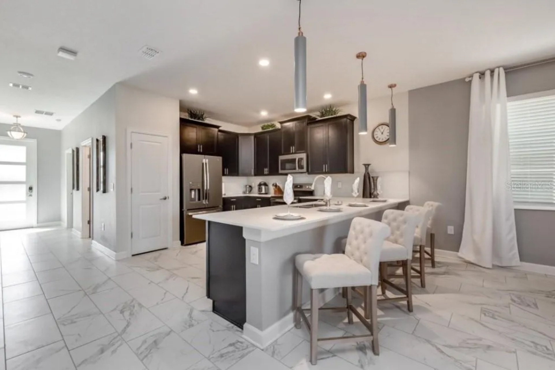 Sit down at the bar top whilst the family cooks up some home cooked meals