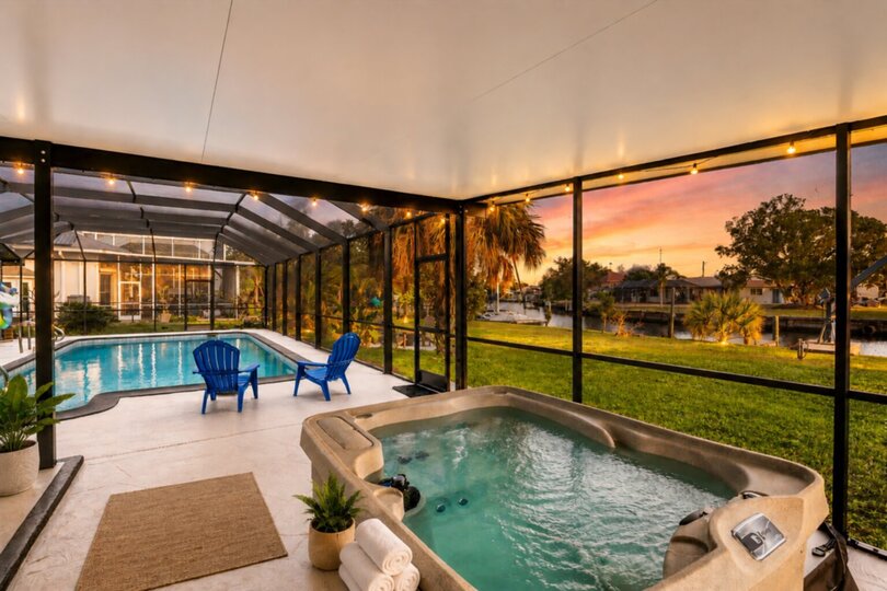 Extra large lanai overlooking the canal. Includes sparkling pool, relaxing hot tub, al fresco dining and more. Pool size: 14' x 28' x 6'