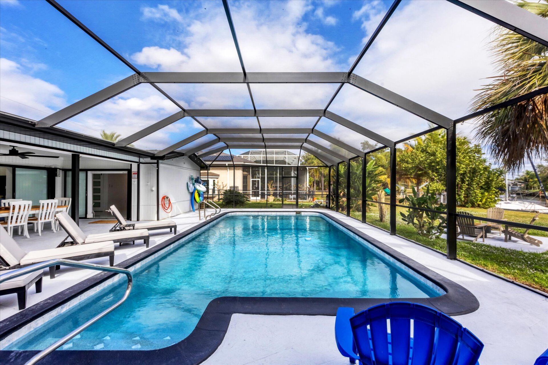 Extra large lanai overlooking the canal. Includes sparkling pool, relaxing hot tub, al fresco dining and more. Pool size: 14' x 28' x 6'