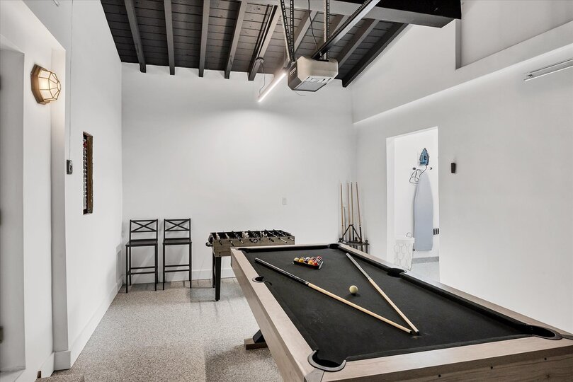 Game room in garage with pool table & foosball