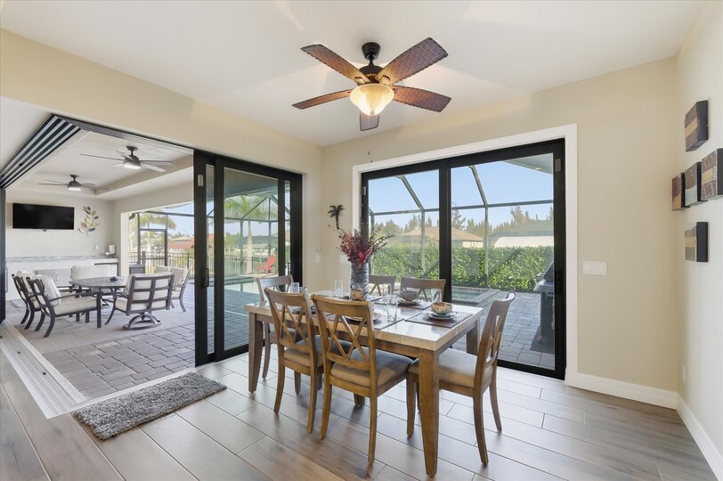 Dining area with pool view. Dining table seats 6