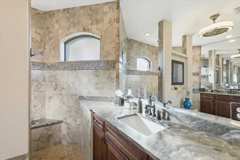 Primary en suite with large walk-in shower and double vanities