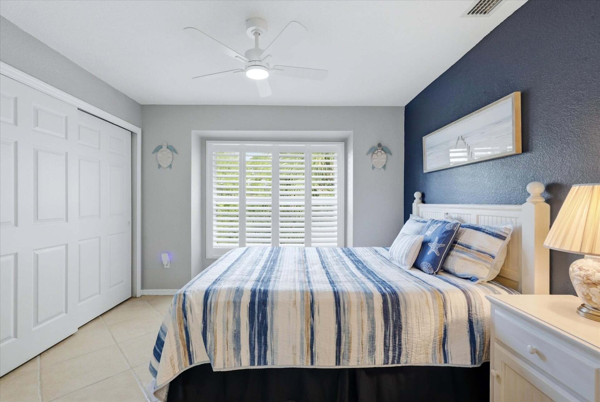 Bedroom 2 with queen bed and 32-inch Smart TV