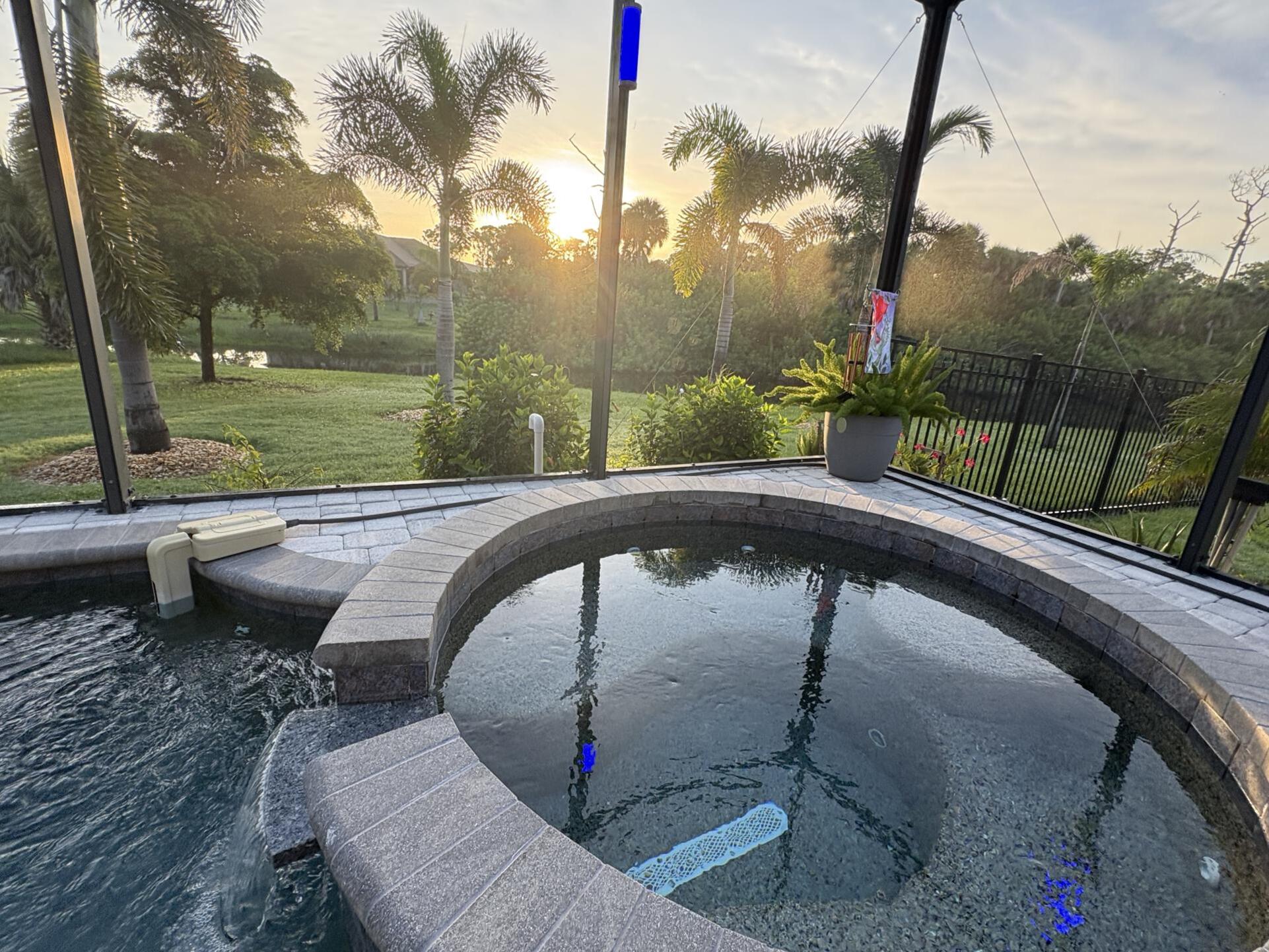 Sparkling pool & spa overlooking canal. Pool size: 22' x 14' x 6'. Spa seats 6
