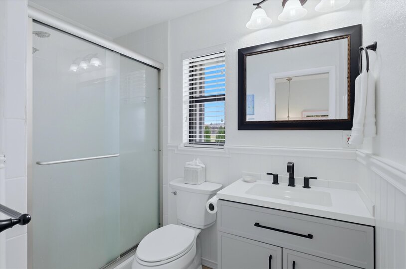 Bedroom 2's attached bathroom with walk-in shower