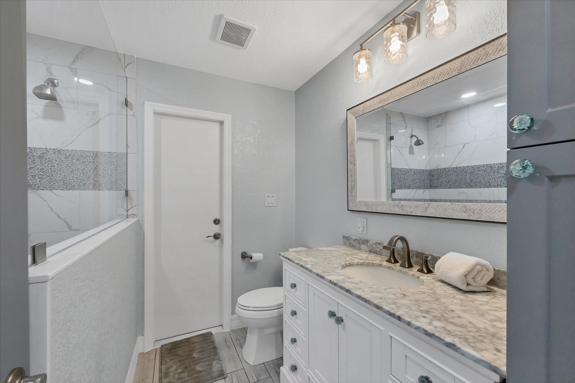 Guest bathroom featuring large walk-in shower