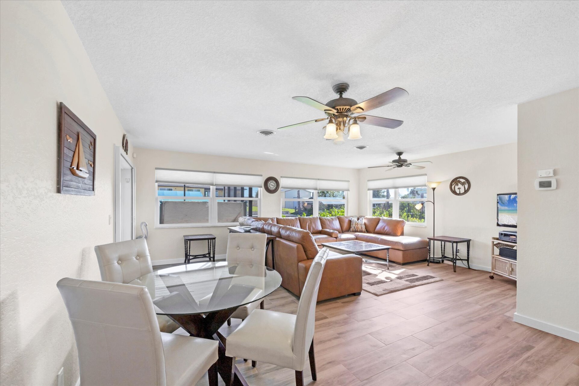 Bright, open living space. Dining table seats 4 with an additional 4 at the kitchen island