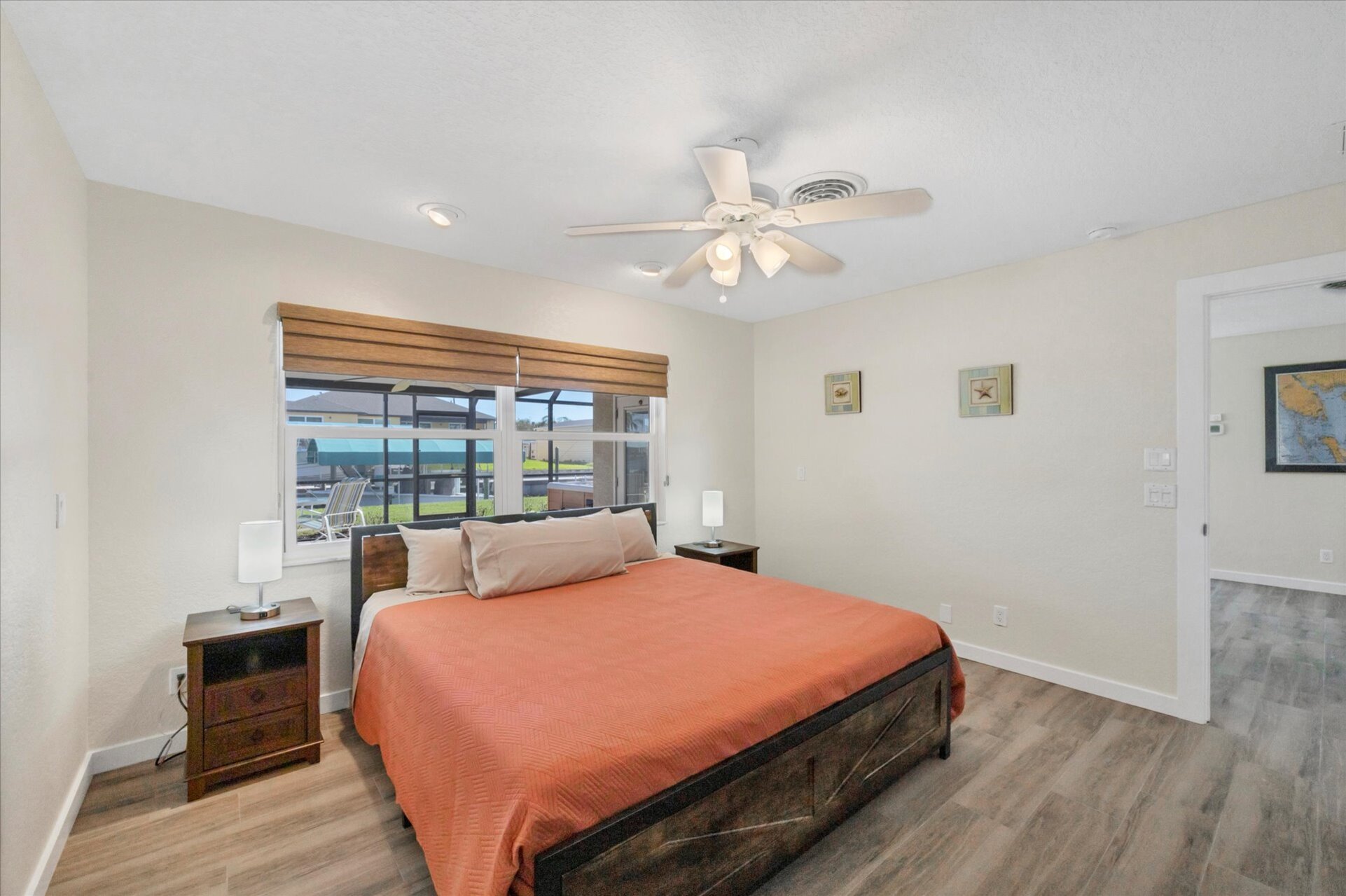 Primary bedroom with king bed, and attached bathroom