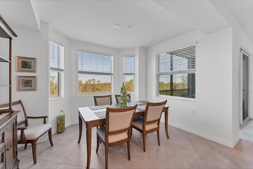 Dining table seats 6 with seating for 3 more at kitchen island