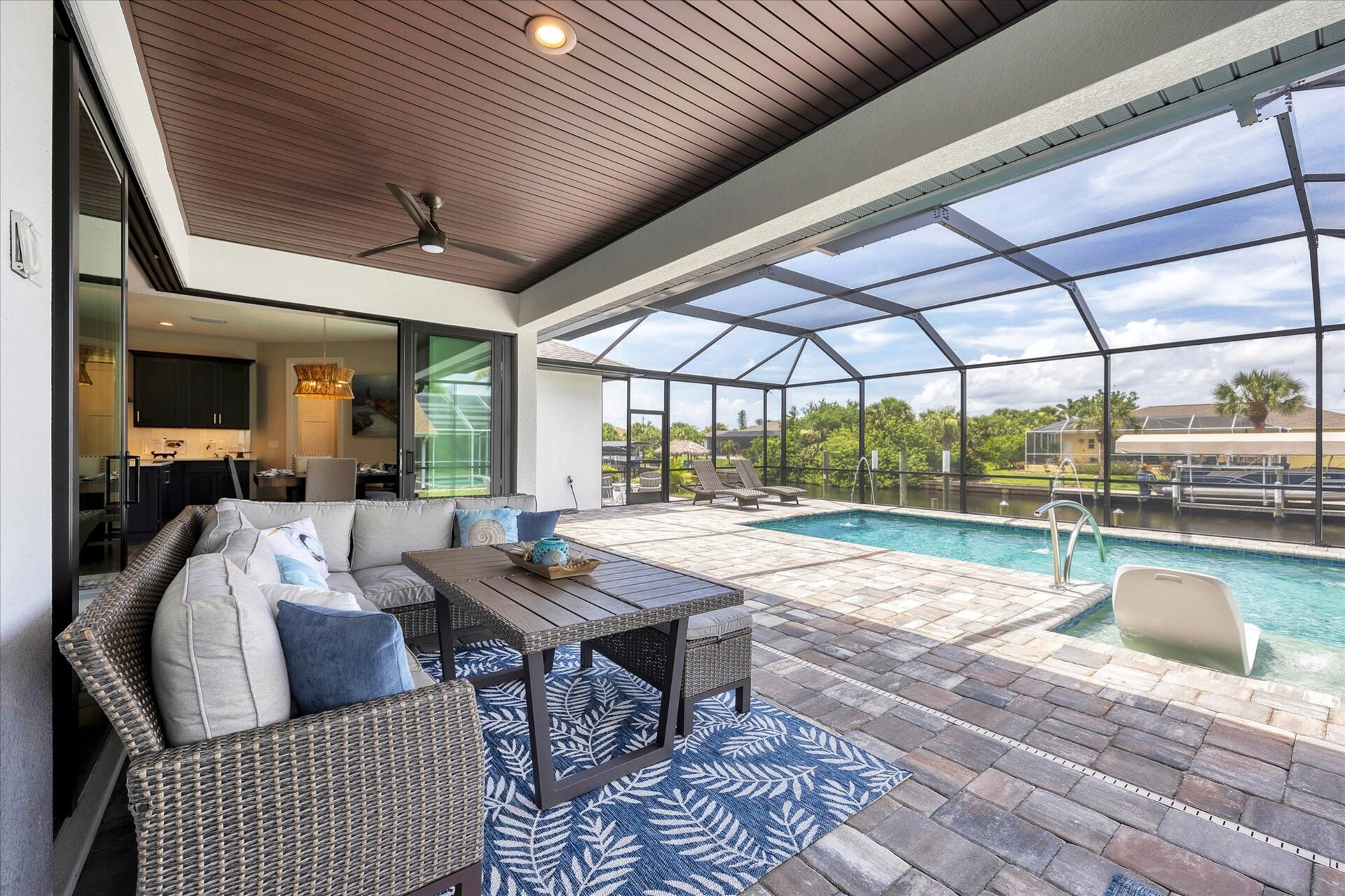 Fantastic outdoor living space overlooking the sparkling pool and canal beyond. Pool size: 24'x12'x6'