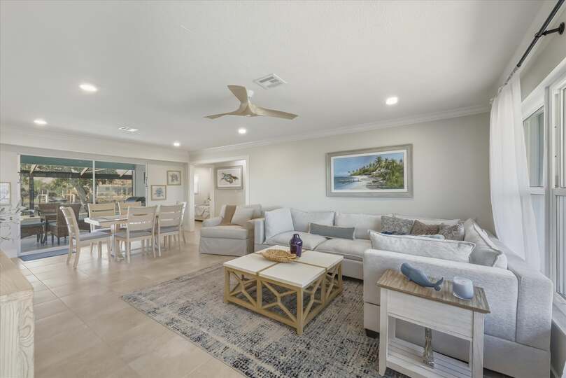 Open living space features lots of comfy seating and 65-inch Smart TV