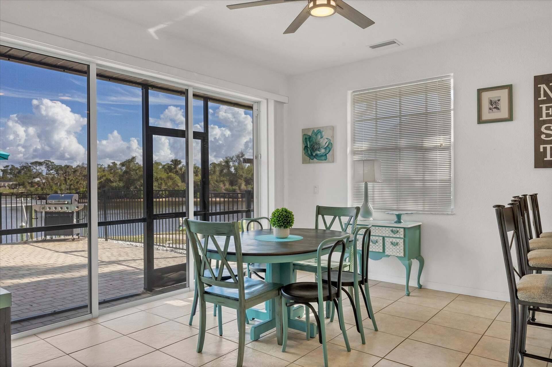 Kitchen nook with lanai access. Kitchen table seats 6 with an additional 3 seats at the kitchen bar