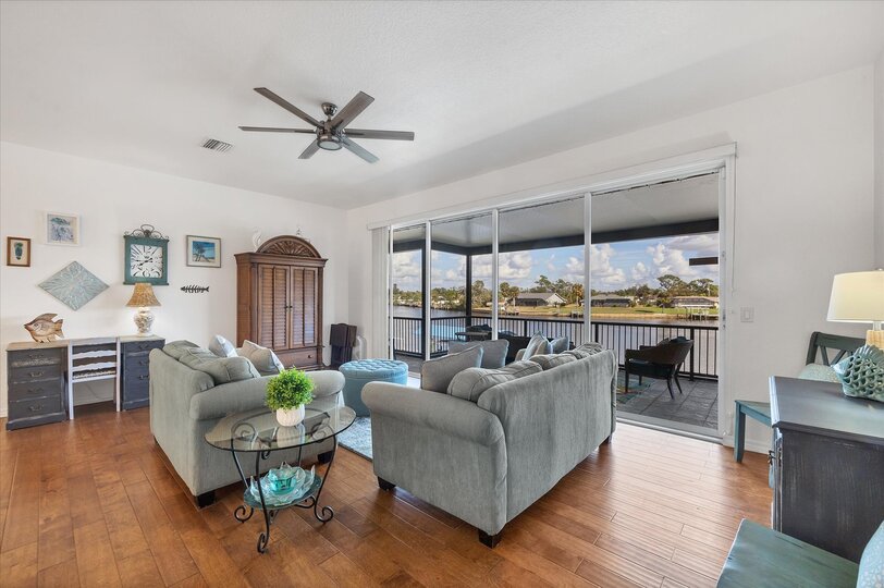 Loft with balcony access. Loft features comfy sofas, desk, queen sleeper sofa, 32" Smat TV and poker table
