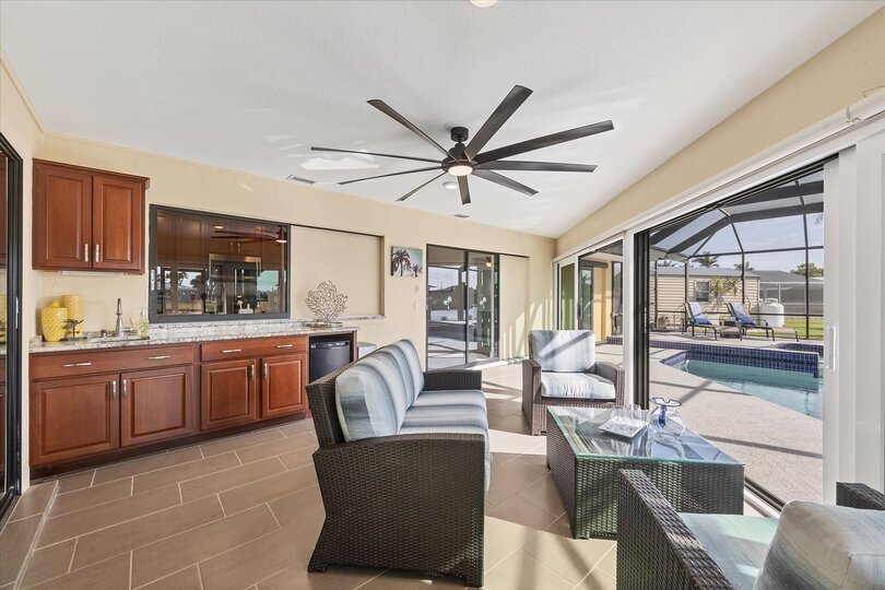Covered lanai overlooking the pool and canal