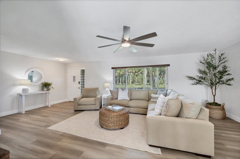 Beautiful, bright, open living space with fantastic view of the pool area and canal beyond