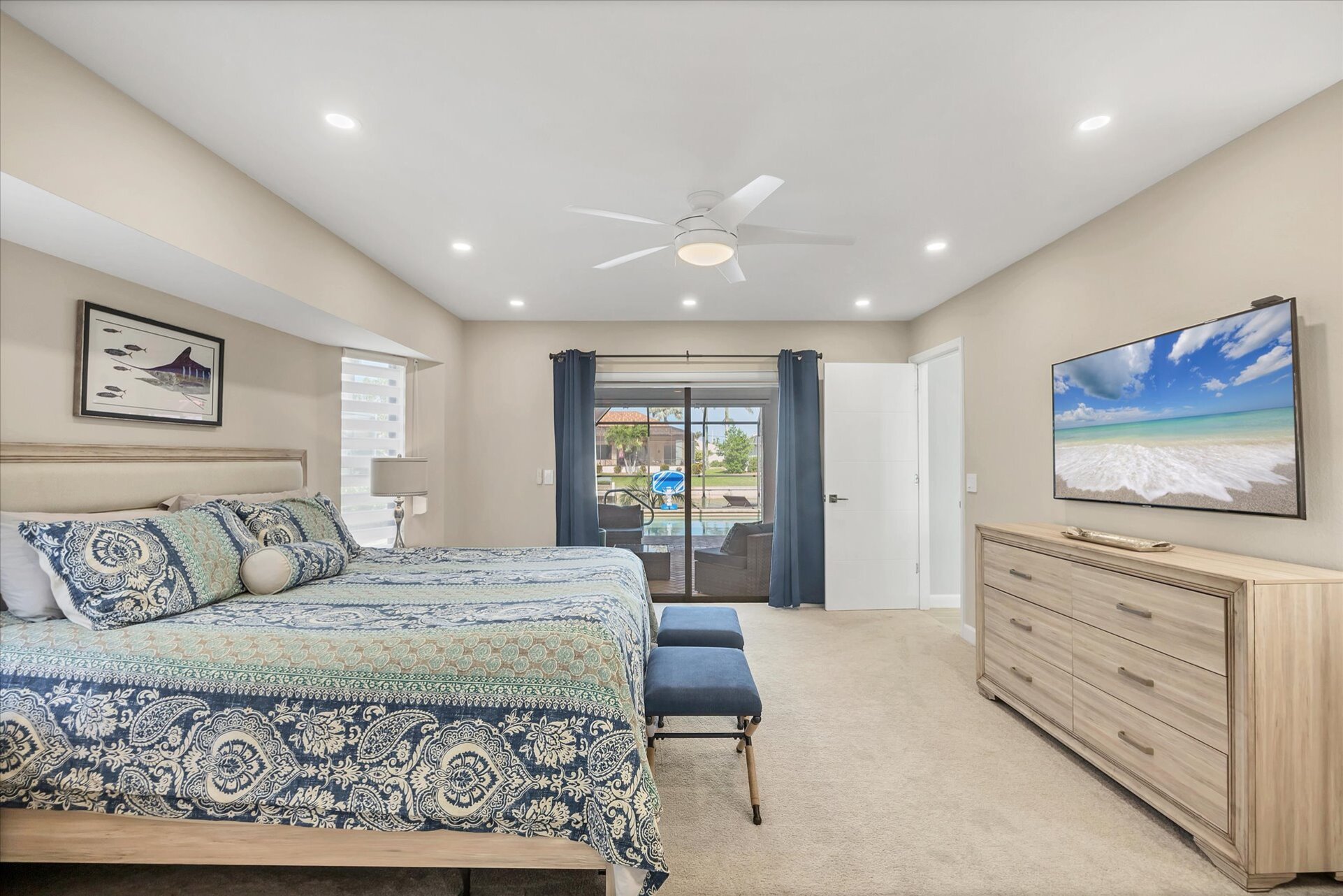Primary Bedroom with King Bed, Attached Bathroom, and 55" Smart TV