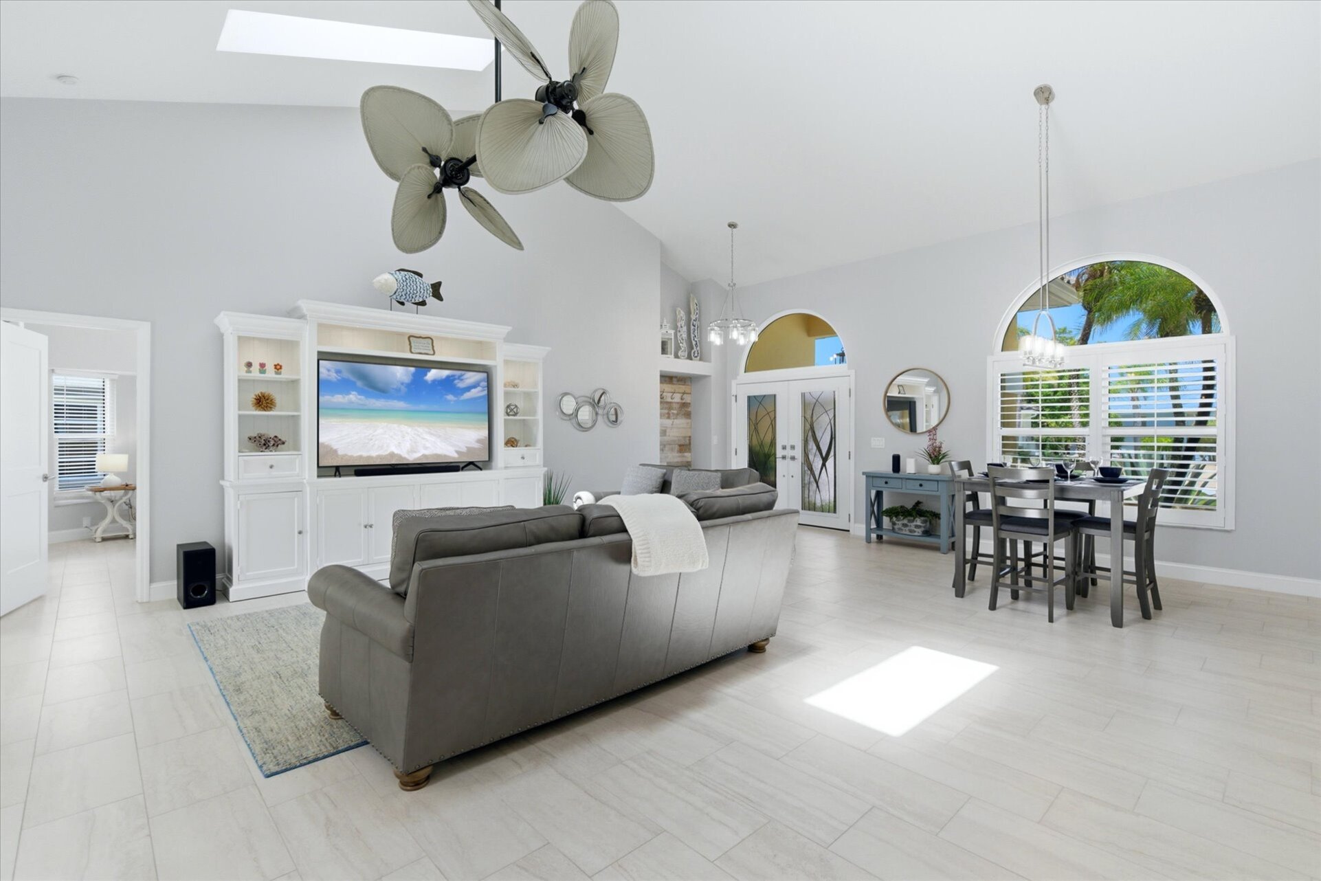 Living room features lots of comfy seating, 70" Smart TV with sound system