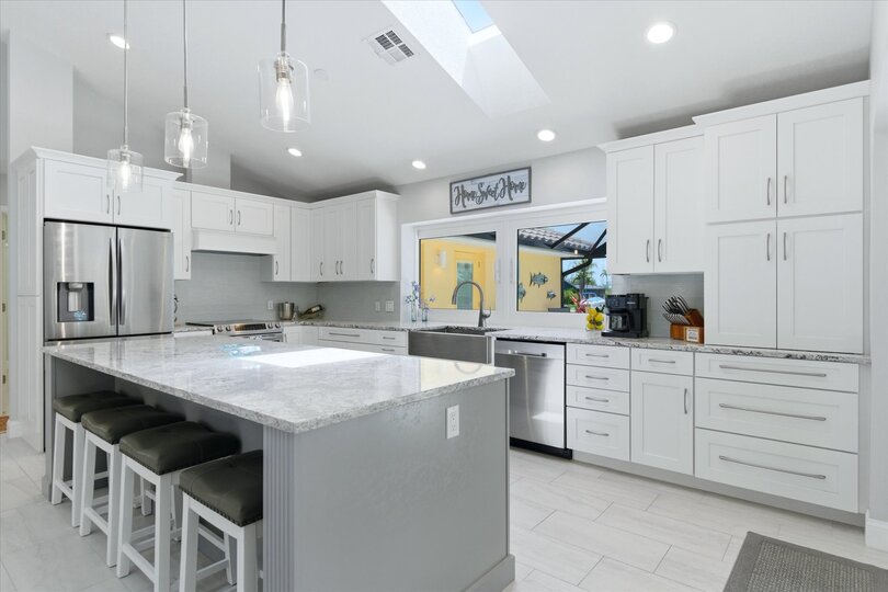 Beautiful, bright, fully-equipped kitchen with huge pass-through window
