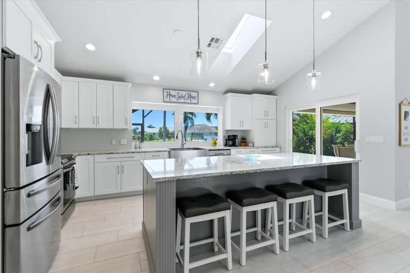 Beautiful, bright, fully-equipped kitchen with huge pass-through window